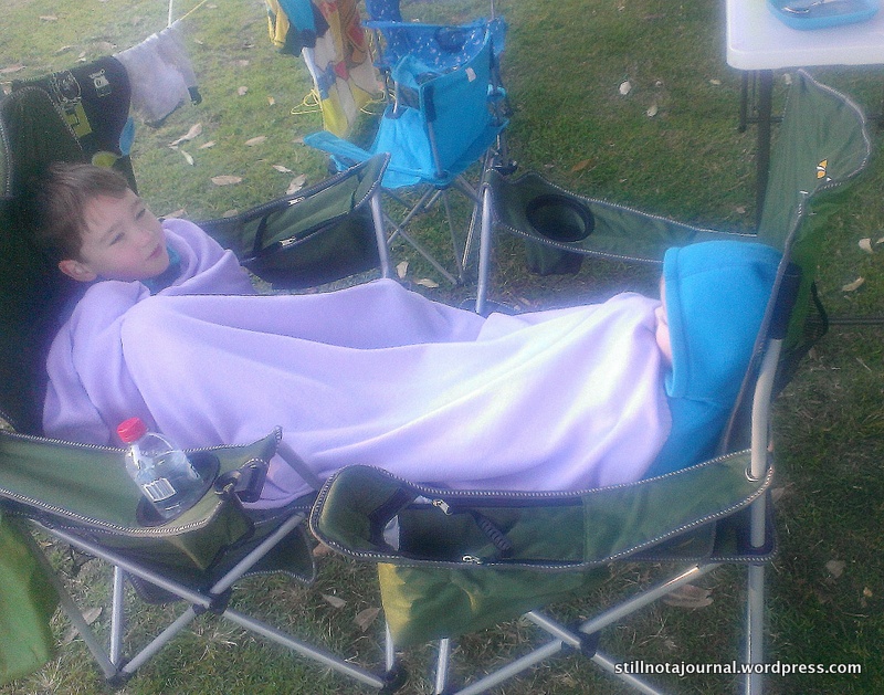 The camping version of morning couch cuddles with Mum. Where’s Mum, you ask? …Camping means making some sacrifices.