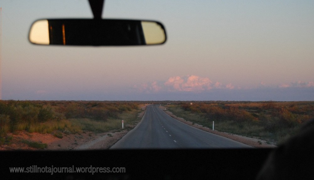 On the road in the clear winter twilight.