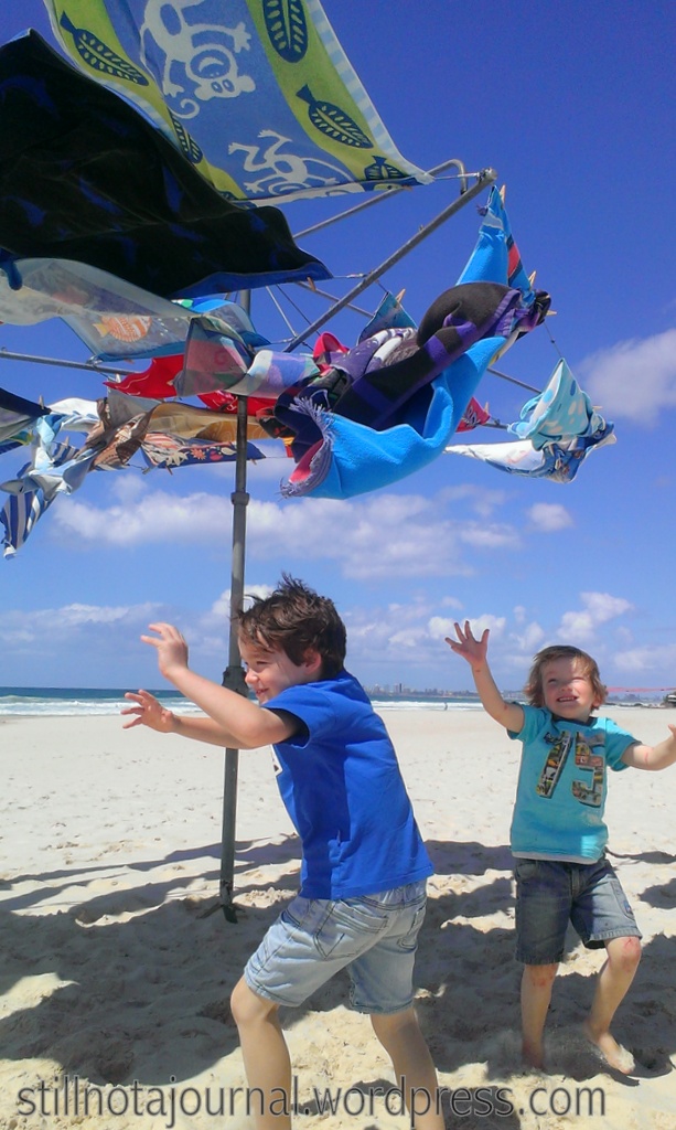 You should always know where your towel is by Greg Quinton. Pre-loved beach towels up on a Hills Hoist - that is a quintessentially Aussie summer image. Somebody get me a pie!
