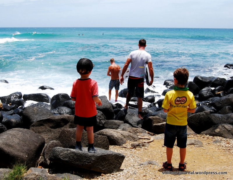 There's access to the beach from the path at several points, and surfers blithely hop across the rocks and into the water without getting smashed on the rocks.