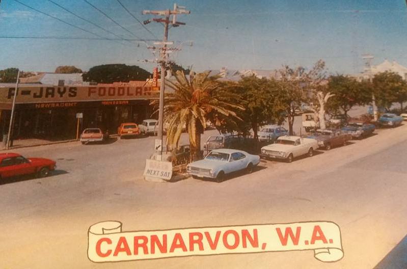The main street of Carnarvon in the 1970s. A little desert oasis town on the West Australian coast. Huge wide street big enough for camel trains to pull a u-turn back in the day, and for walking down the middle of after getting kicked out of the Carnarvon Hotel at closing time (midnight)